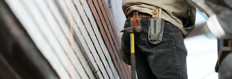 a personal wearing a tool belt