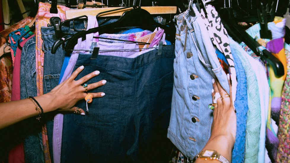 a person looking through clothes