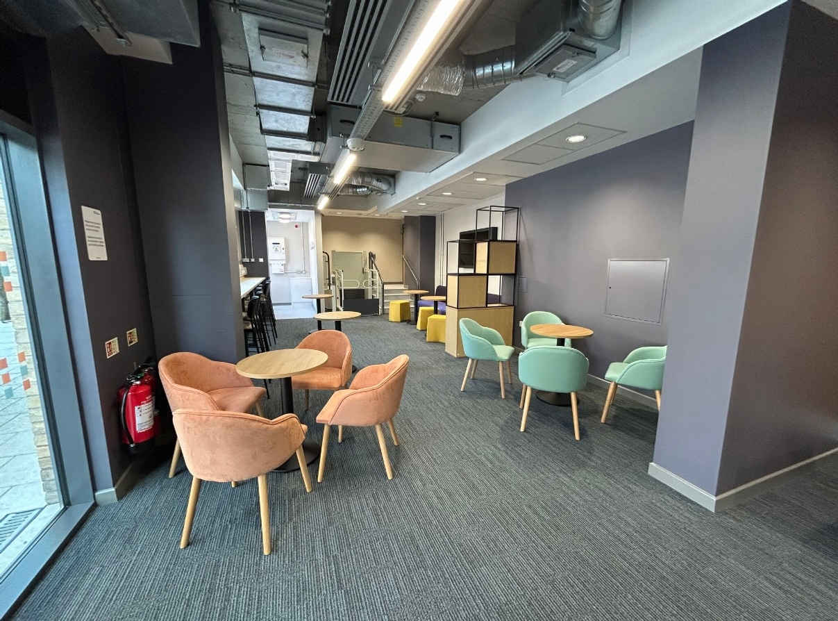 a room with a table and looking at the camera