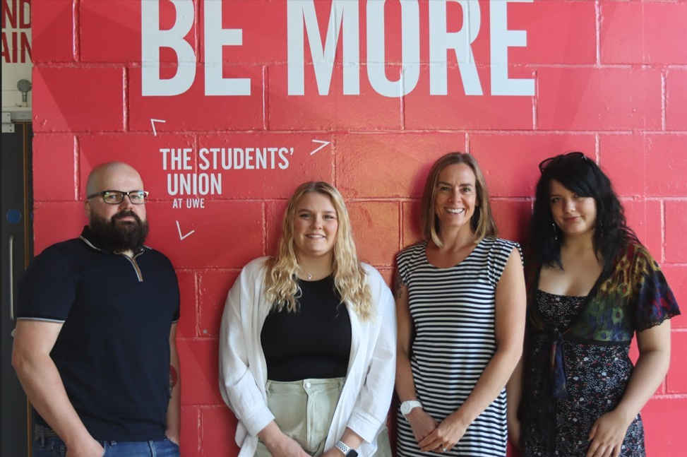 a group of people posing for the camera