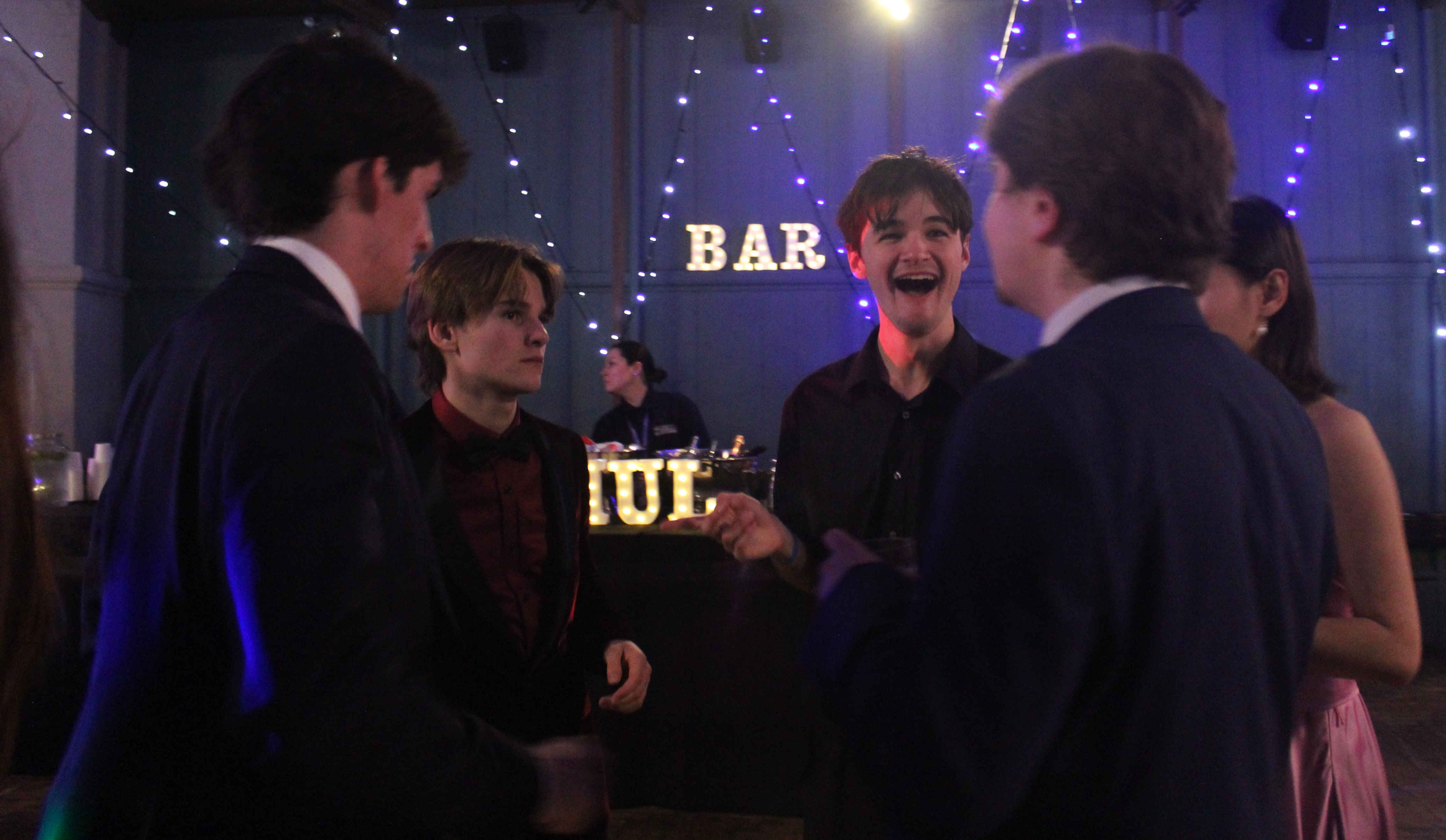 winter ball male students smiling at each other