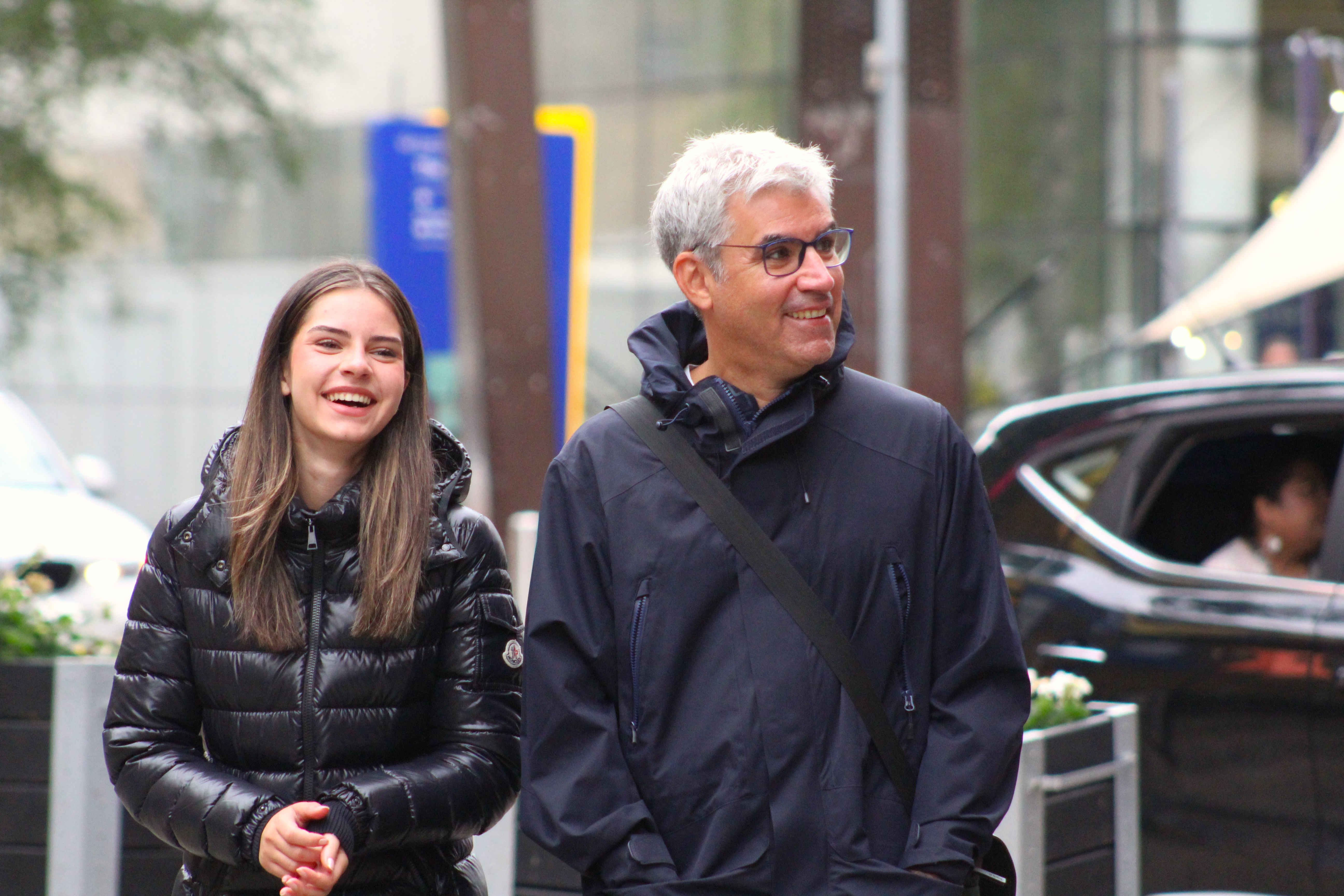 Nabeel Rajab et al. standing in front of a building