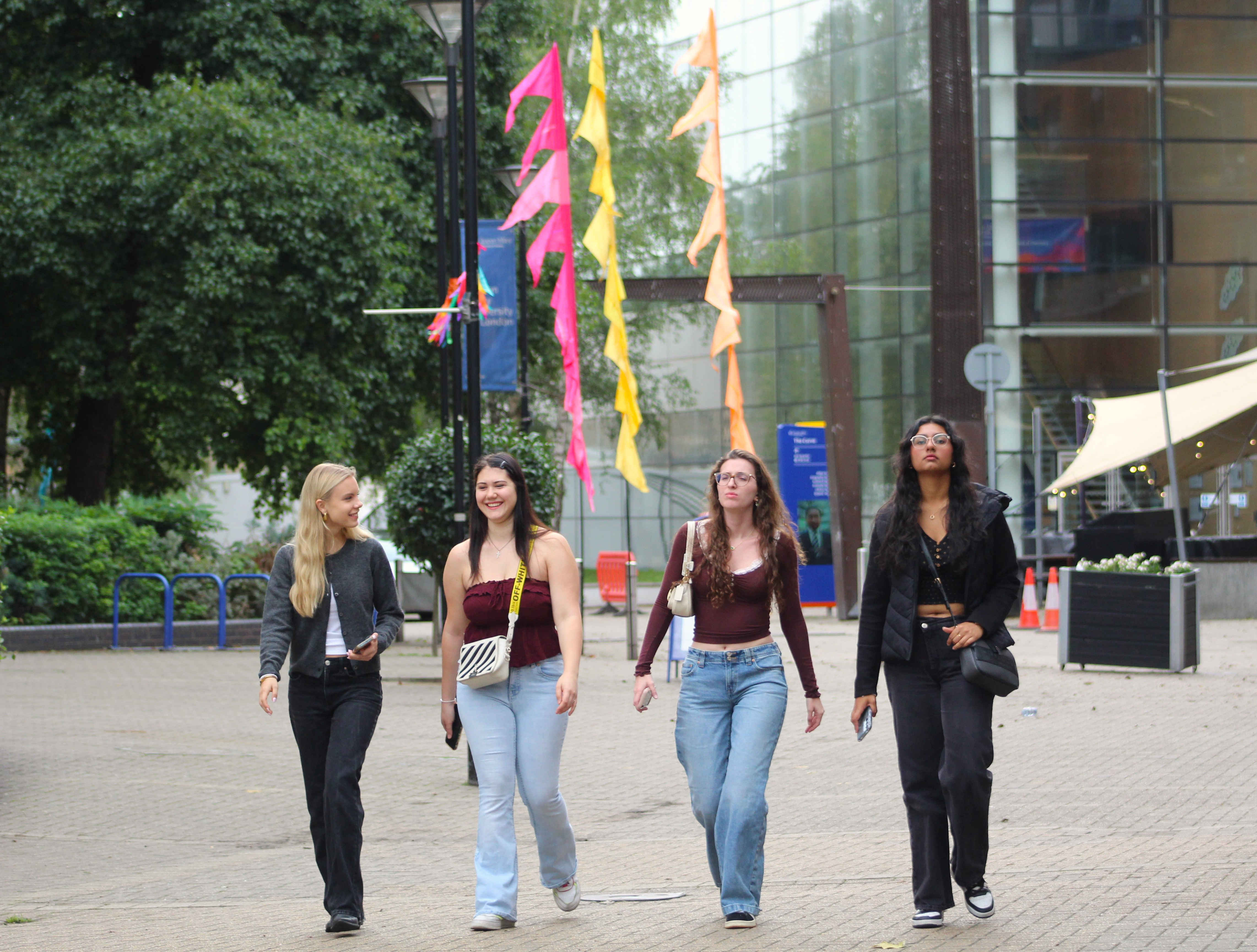 a group of people walking down a street