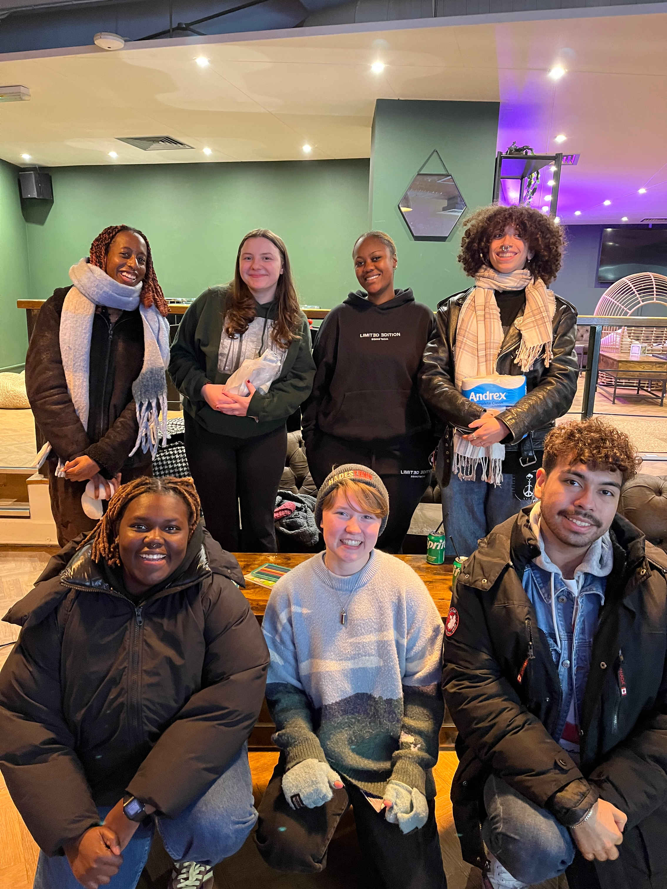 a group of people posing for the camera