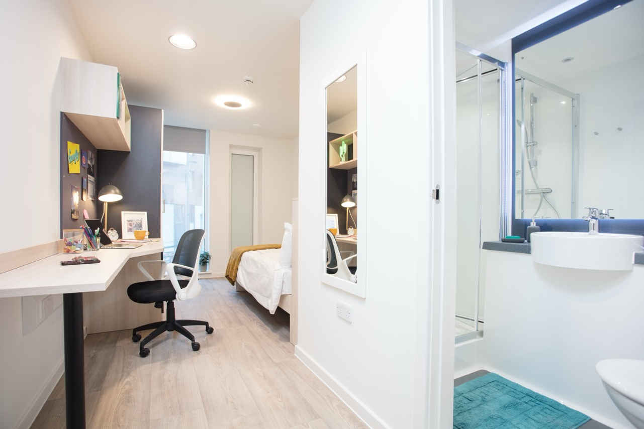 a room with a sink and a mirror