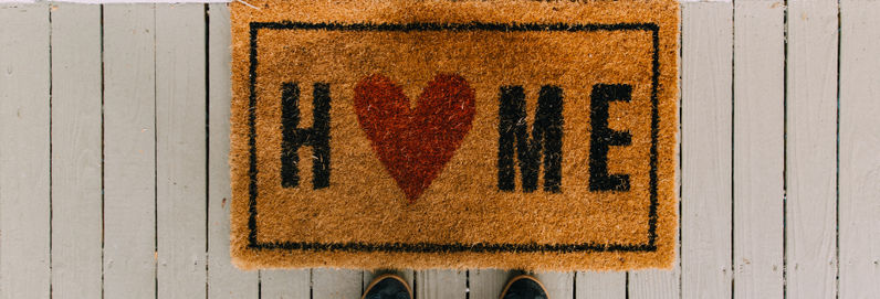 doormat that says home