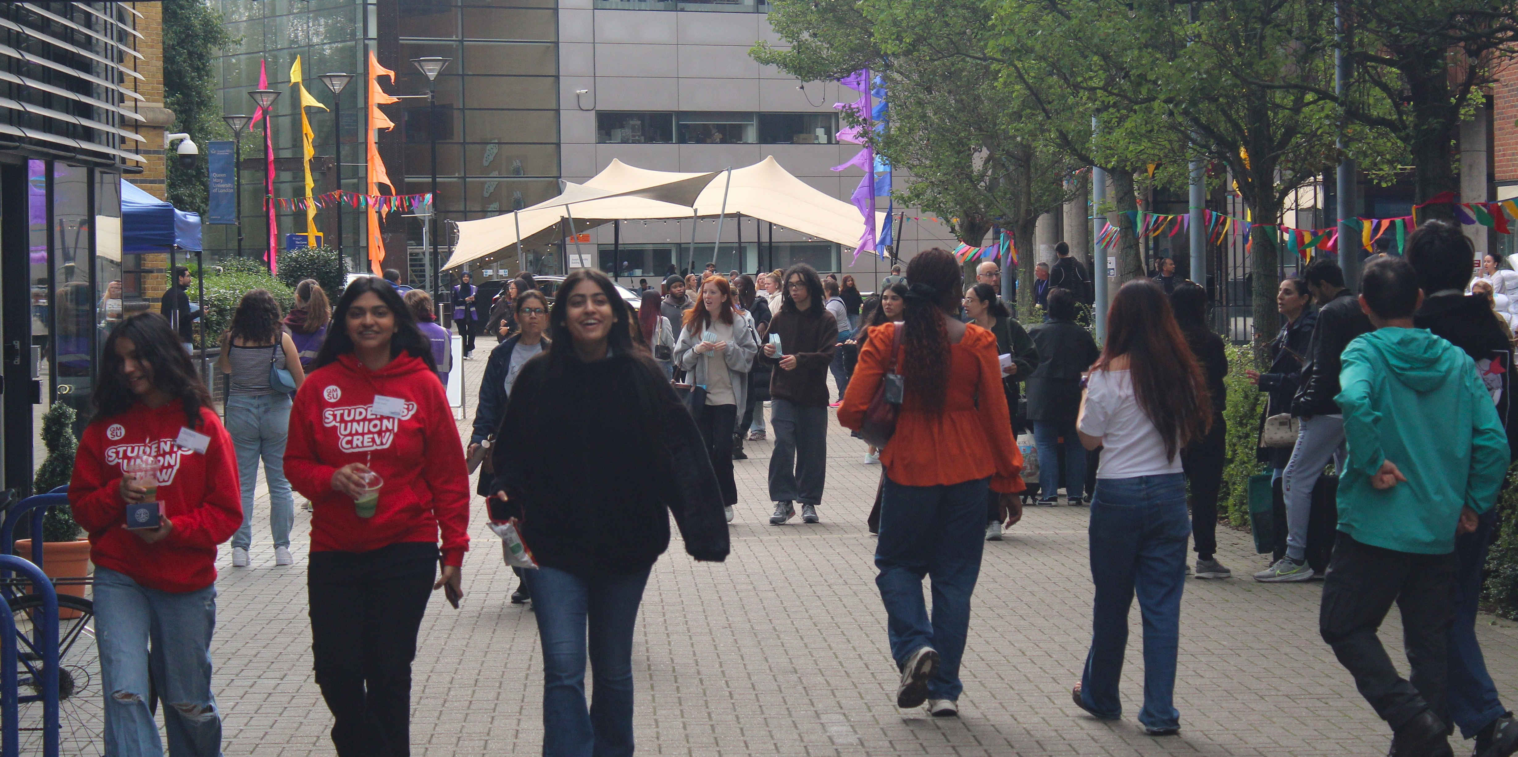 a group of people walking down the street