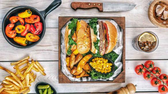 a bunch of food sitting on top of a wooden table
