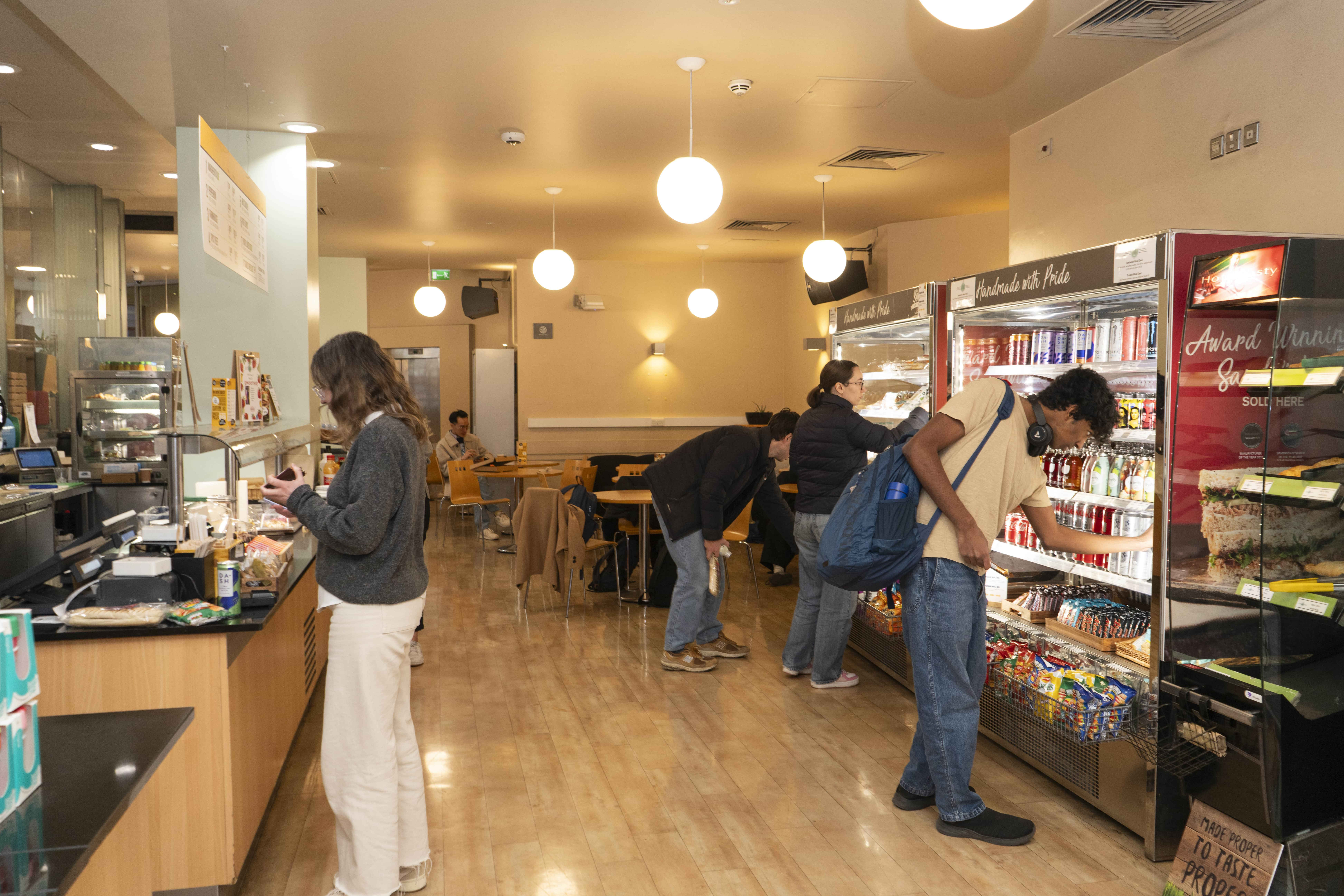 a group of people at LSE Garrick Cafe ordering food