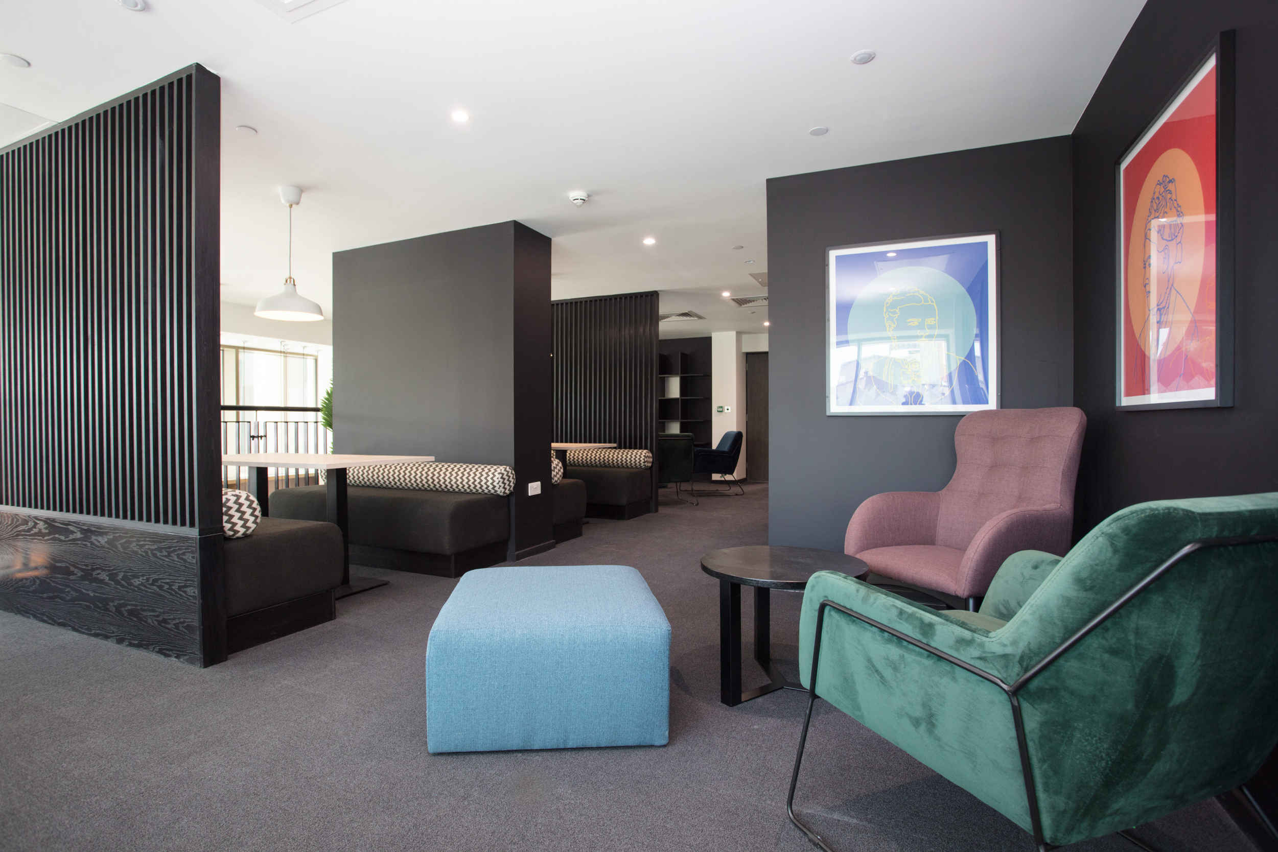 a living room filled with furniture and a flat screen tv