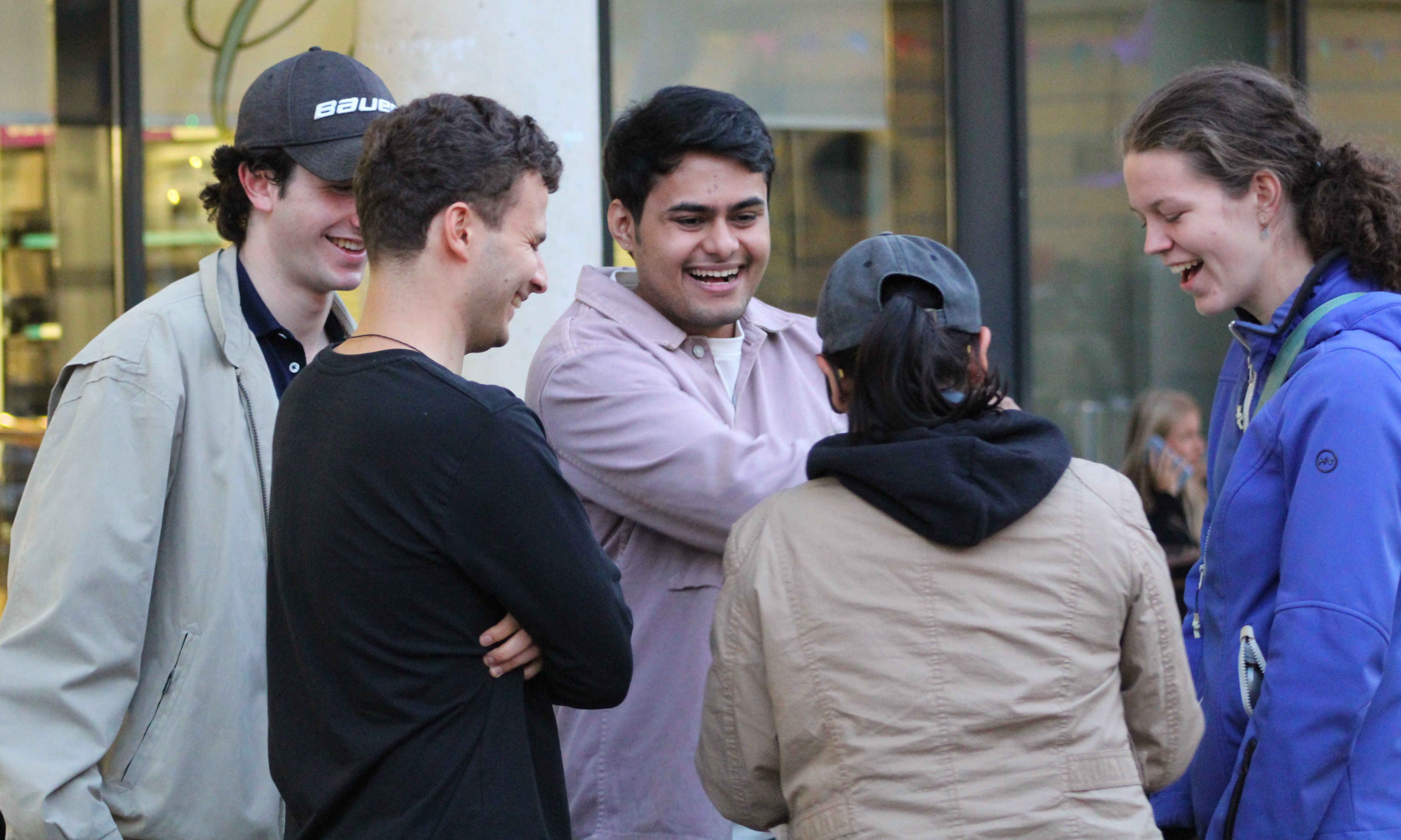 a group of people standing in front of a crowd