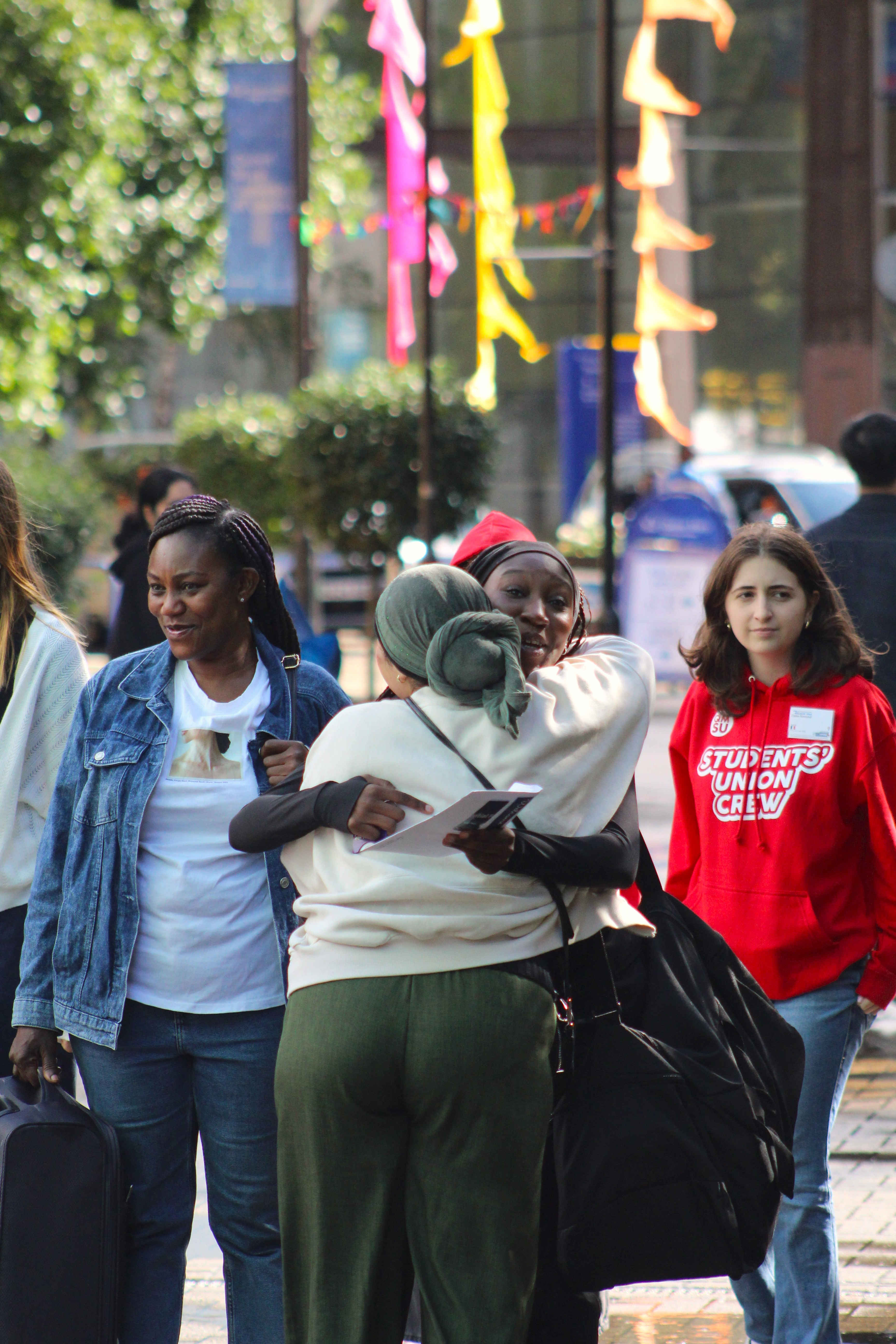 a group of people walking down the street