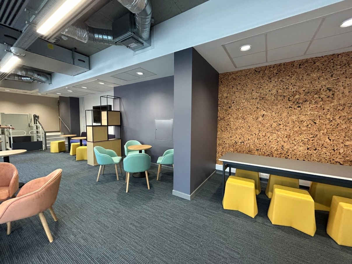 a room filled with furniture and a large window