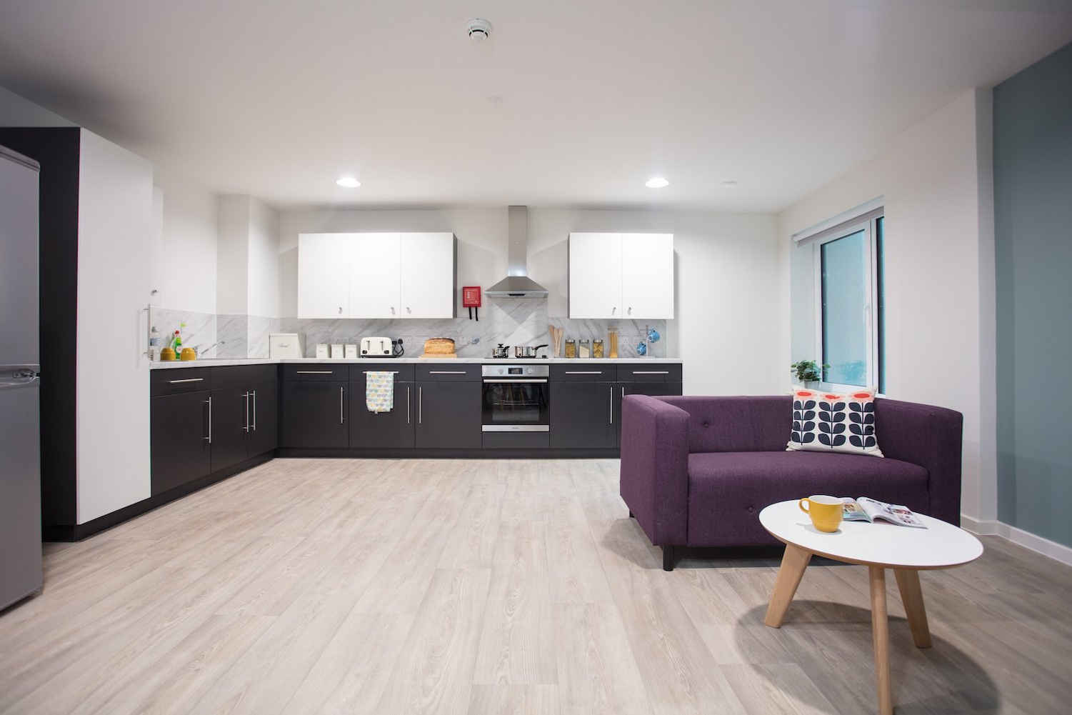 a living room filled with furniture and a flat screen tv
