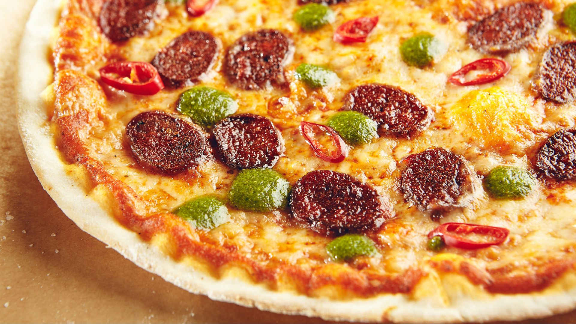 a small pepperoni pizza sitting on top of a table